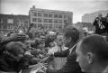 Photograph: [President Kennedy greeting the crowd outside the Hotel Texas]