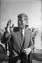 Photograph: [President Kennedy waving to the crowd at Love Field]