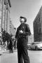 Photograph: [A Dallas Police officer outside the Texas School Book Depository]