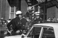Photograph: [Dallas Police officers in the intersection of Elm and Houston street…