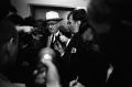 Photograph: [Tom Howard speaking to reporters at the Dallas Police Department]