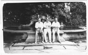 Primary view of object titled '[George A. Hill, Jr. with sitting with unidentified men near fountain]'.