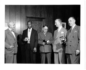 Primary view of object titled '[Joe and Abe Weingarten with Irving Alexander and unidentified men holding watches]'.