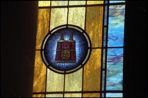 Primary view of object titled '[Stained Glass Window Pane of a Torah Mantle]'.