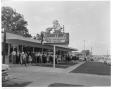 Photograph: [Customers standing outside Youngblood's Fried Chicken restaurant]