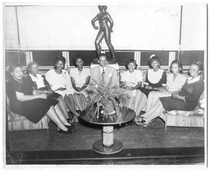 Primary view of object titled '[Photograph of a Group Seated in Front of a Window]'.