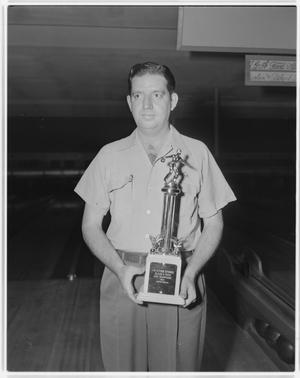 Primary view of object titled 'Unidentified Man With Trophy'.