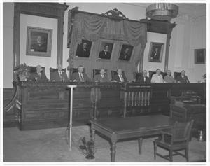 Primary view of object titled '[Full Supreme Court seated on bench]'.