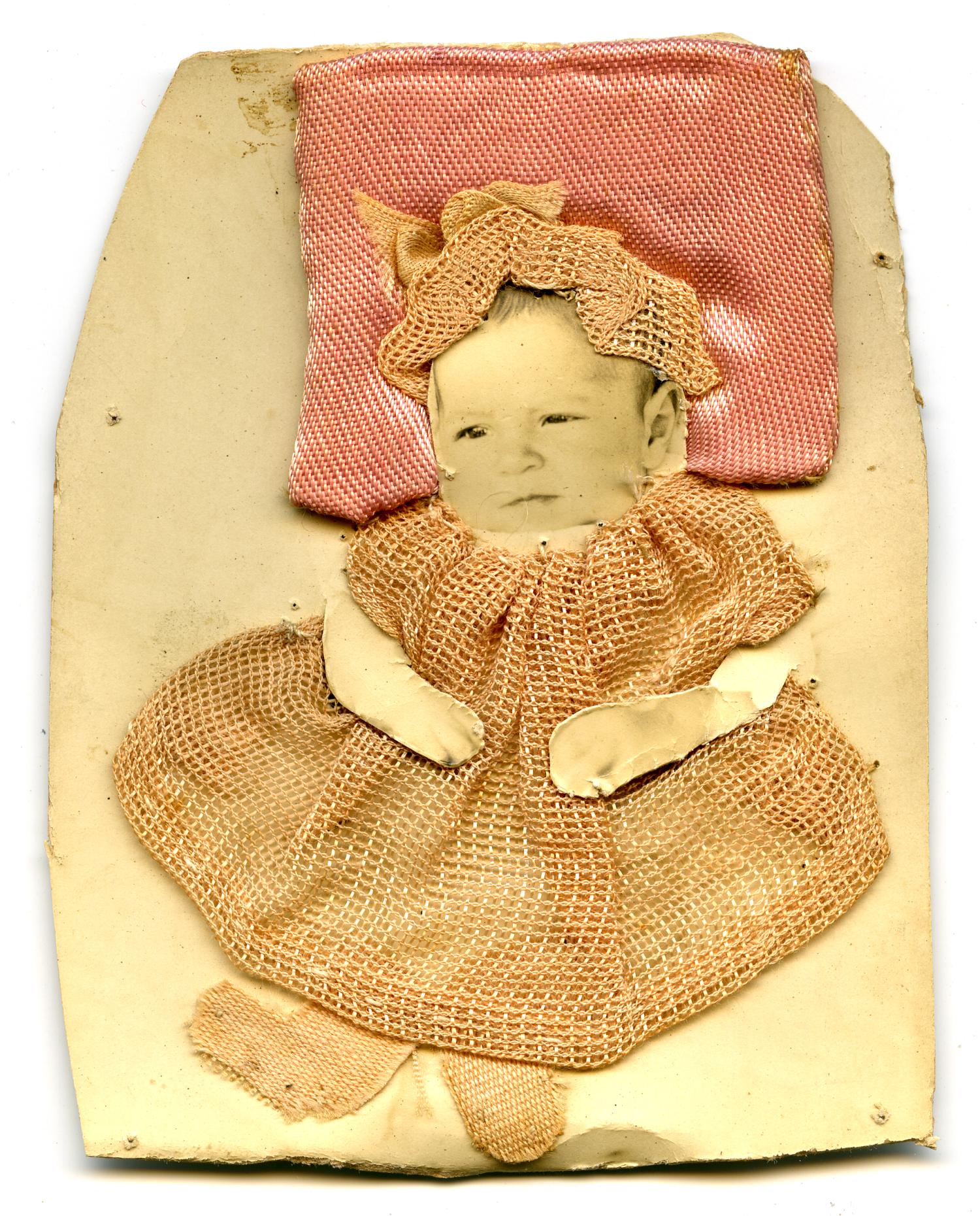 [Photograph of a Baby Wearing an Embroidered Dress]
                                                
                                                    [Sequence #]: 1 of 2
                                                