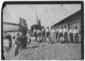 Photograph: [Men Standing on Grain Dock]