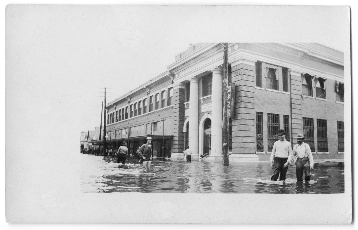 [Bank Building During Flood]
                                                
                                                    [Sequence #]: 1 of 2
                                                