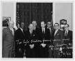 Photograph: [Eight Men in Office]