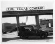 Primary view of [Car in Front of Texas Company Sign]