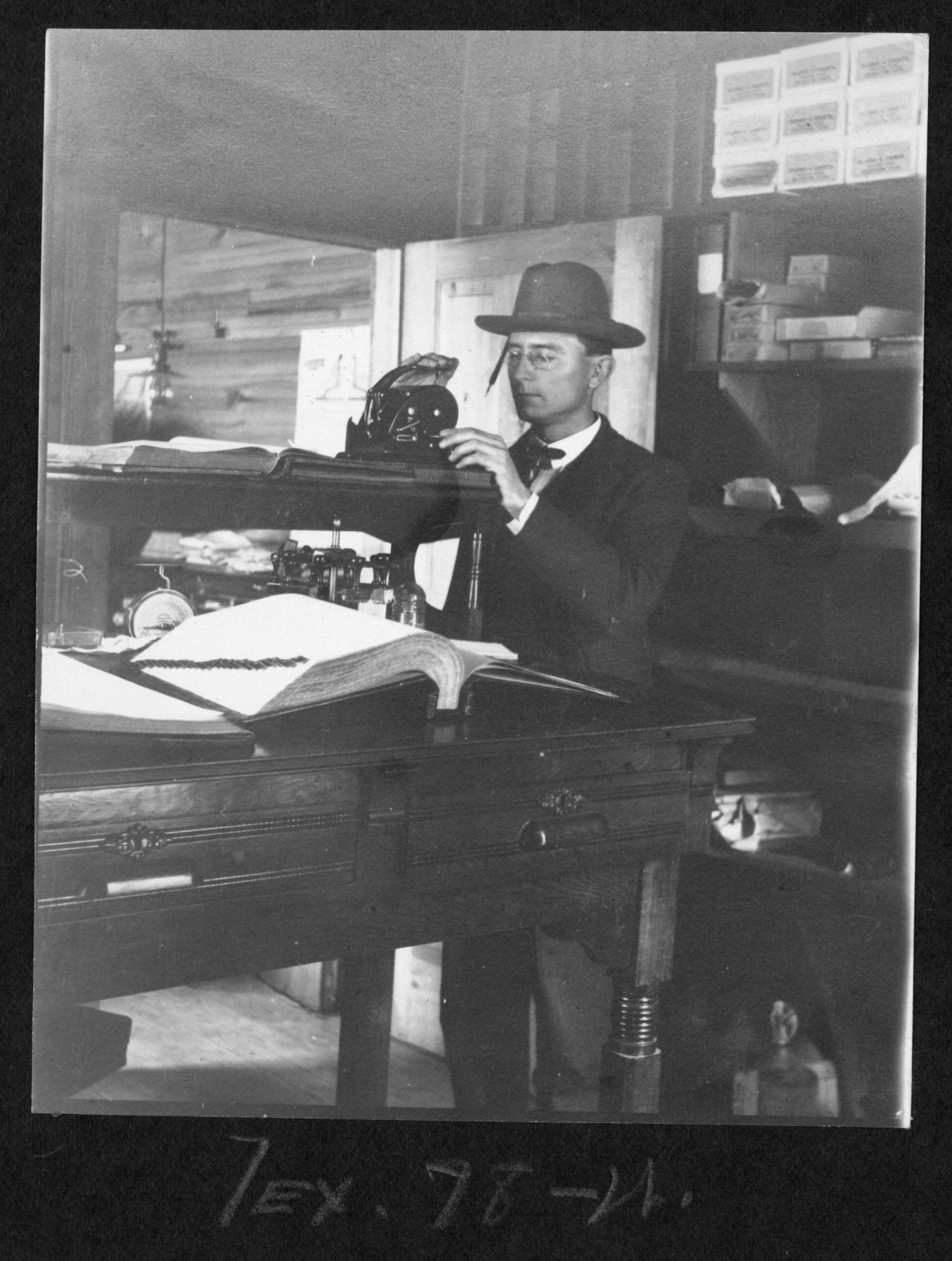 [Southern Pine Lumber Company Worker with Record Books]
                                                
                                                    [Sequence #]: 1 of 1
                                                