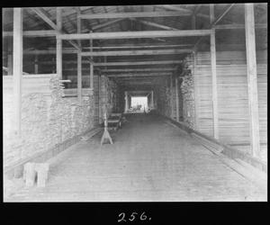 Primary view of object titled '[Rough Lumber Shed Interior]'.