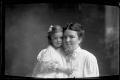 Photograph: [Woman and a little girl in white dresses]