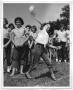 Thumbnail image of item number 1 in: '[Photograph of Dominga Luna Throwing a Softball]'.