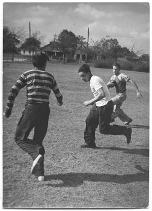 Primary view of object titled '[Photograph of Boys Playing Football in Exline Park]'.