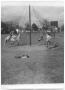 Photograph: [Photograph of Children Playing with a Phylon Swing in Exline Park]