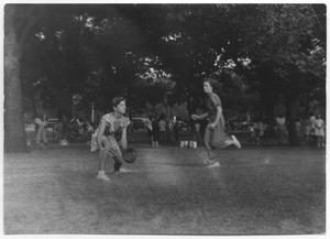 Primary view of [Photograph of Girls Playing Softball in Reverchon Park]