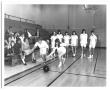 Primary view of [Photograph of Students Learning How to Bowl at a School Gym]
