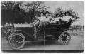 Photograph: [Group of men in new car]