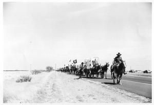 Primary view of object titled 'Texas Sesquicentennial Wagon Train on Its Way to Kingsville'.