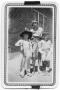 Photograph: [Teacher and students in costume]