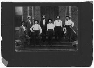 Primary view of [Men standing on porch]