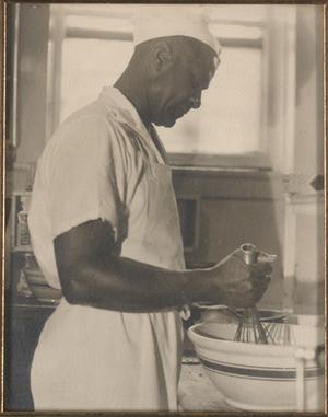 Primary view of object titled '[T. C. Hill in the kitchen at Texas State College for Women, 1944]'.