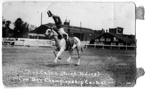 Primary view of object titled 'Bob Calen trick riding - Cowboy Championship Contest, c. 1920'.