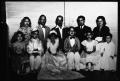 Photograph: [Photograph of adults with children in fancy dress]