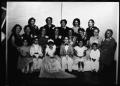 Photograph: [Photograph of women with children in fancy dress]