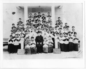 Primary view of object titled '[Catechism class of boys with priest]'.