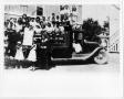 Photograph: [Children and nuns in a truck]