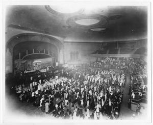 Primary view of object titled '[Photograph of a Mass service at the Old City Auditorium]'.