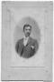 Photograph: [Photograph of a man dressed in a three-piece suit]