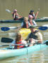 Primary view of [Group of people kayaking on a body of water]