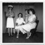 Photograph: [Three Women and Young Girl on Auditorium Stage]