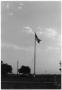 Primary view of Brodsgaard raising flag
