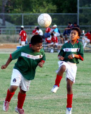 Primary view of object titled '[Boys playing soccer]'.