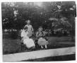 Photograph: [Two Seated Women with Man]