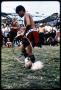 Primary view of [Young Alabama-Coushatta Indian Dancer Performs for Crowd]