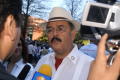 Photograph: [Hector Flores speaking to media]