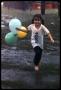 Photograph: [Girl Running With Balloons in the Rain]