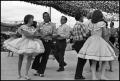 Photograph: [Alamo Area Square Dancers Performing On Stage]