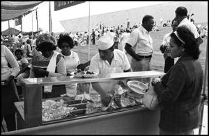 Primary view of object titled '[African American Food Booth Serving Soul Food]'.