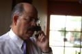 Photograph: [Hector Flores talking on cellular phone]