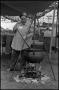 Photograph: [Doris Riedel Stirring Pot of Lye Soap]