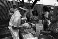 Primary view of [Dr. John Hale Baking Bread at the 4th AnnualTexas Folklife Festival]